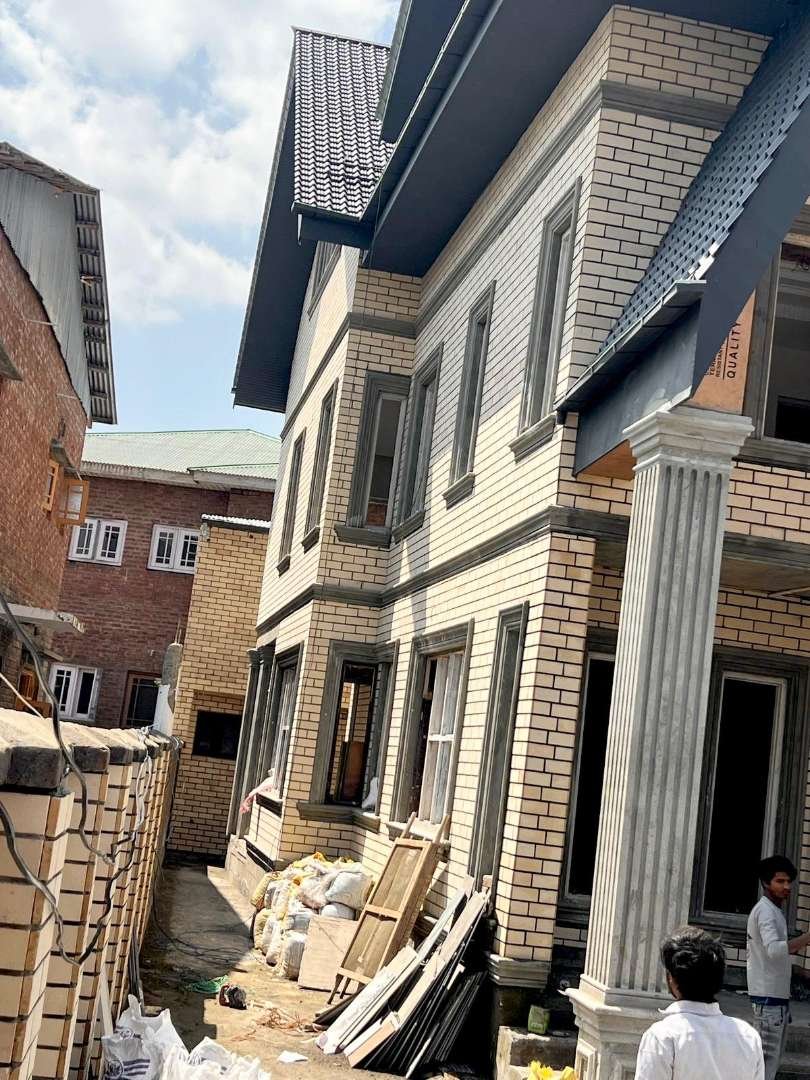 Cream brick cladding on residential building — Bricks Street