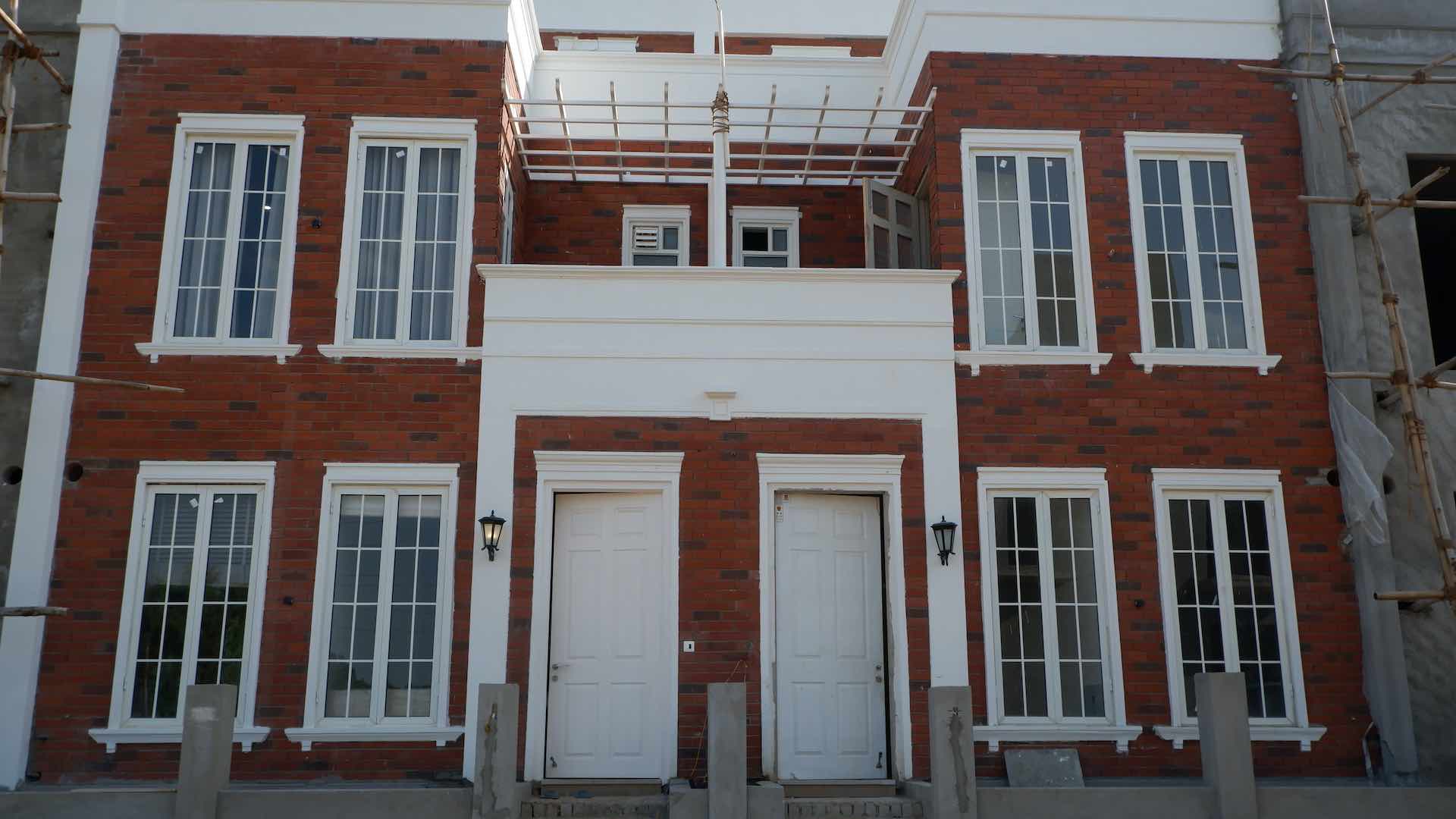 Exposed brick cladding on residential building by Bricks Street India
