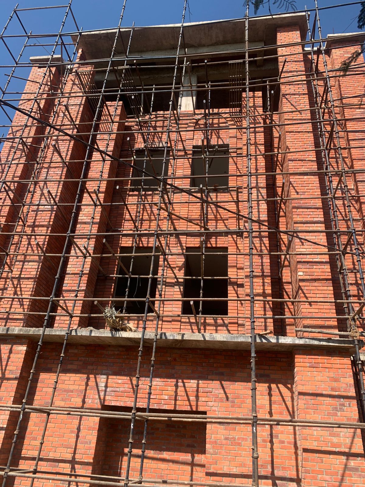 Multi-storey wire cut brick building under construction — Bricks Street