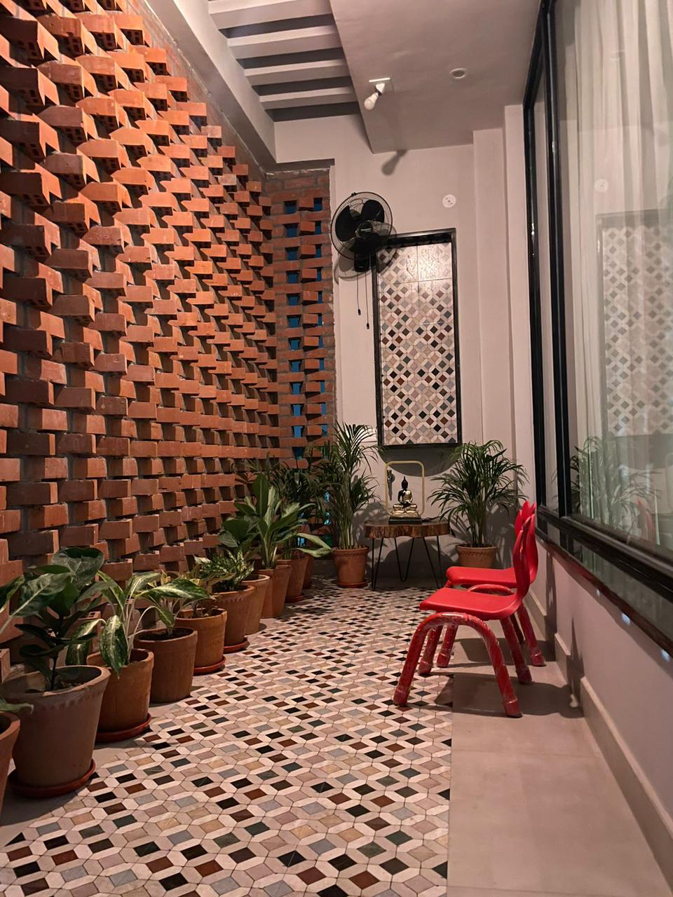 Interior courtyard with exposed wire cut brick wall — Bricks Street